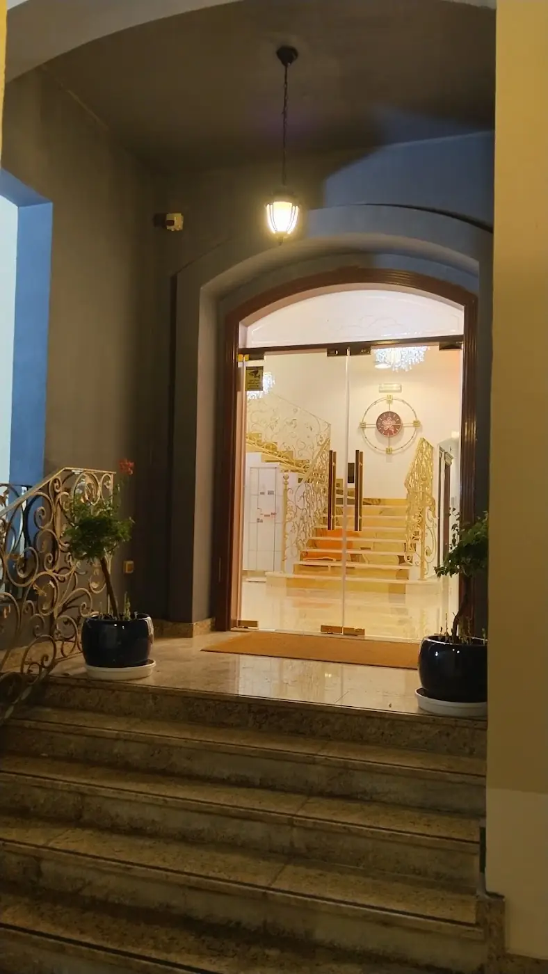 Arched glass entrance of the clinic at night