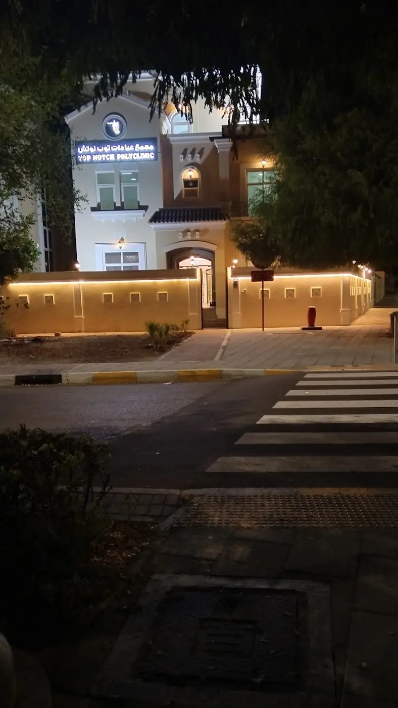 TopNotch Polyclinic villa lit up at night
